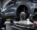 Technician measuring an electric vehicle wheel hub and center bore